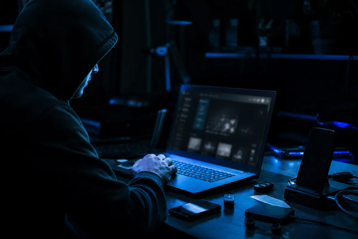 A person engaged in browsing dark web sites, illustrating the evolving landscape of hidden internet in 2026.